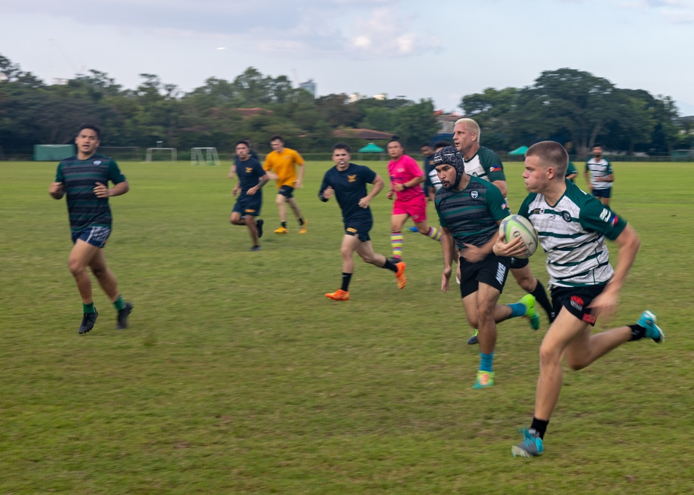 Ronald Reagan Carrier Strike Group Sailors play rugby in the community during port visit to Manila