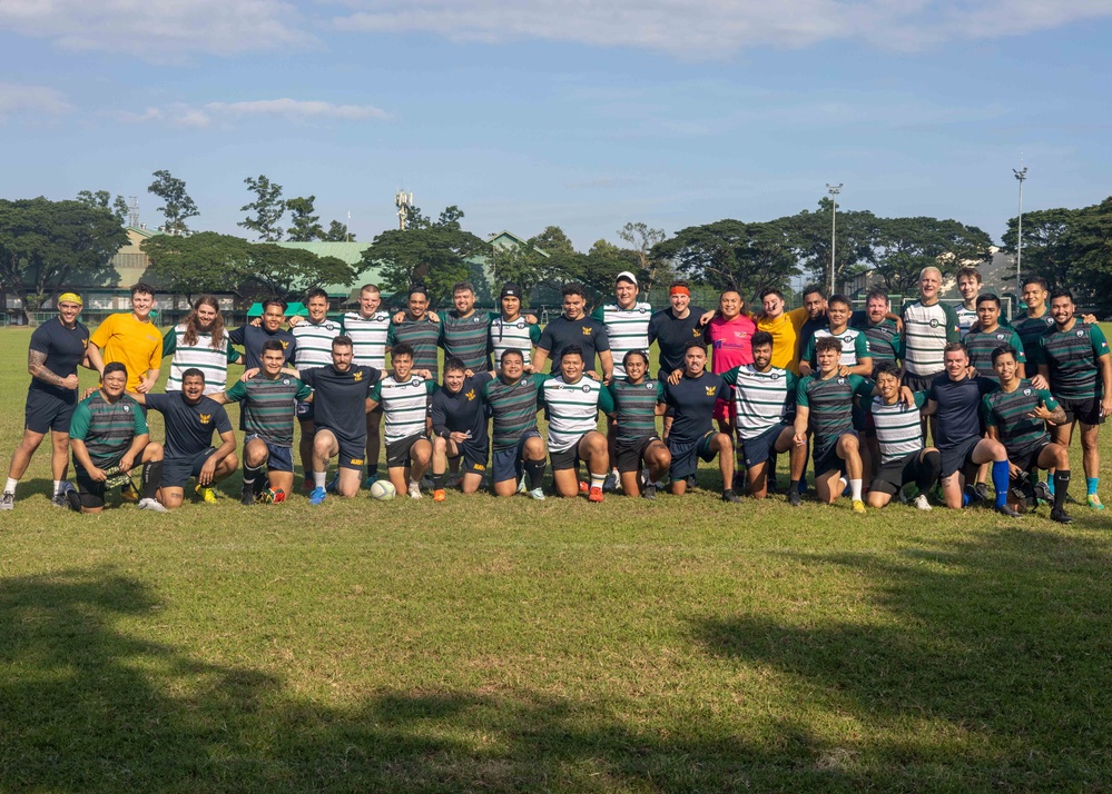 Ronald Reagan Carrier Strike Group Sailors play rugby in the community during port visit to Manila