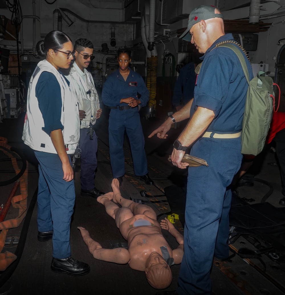 Sailors aboard the USS Rafael Peralta (DDG 115) conduct a crash and salvage drill in the South China Sea