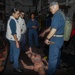 Sailors aboard the USS Rafael Peralta (DDG 115) conduct a crash and salvage drill in the South China Sea