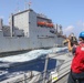 Sailors aboard the USS Rafael Peralta (DDG 115) conduct a replenishment-at-sea with the Lewis and Clark-class dry cargo USNS Wally Schirra (T-AKE-8) in the South China Sea