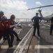 Sailors aboard the USS Rafael Peralta (DDG 115) conduct a crash and salvage drill in the South China Sea