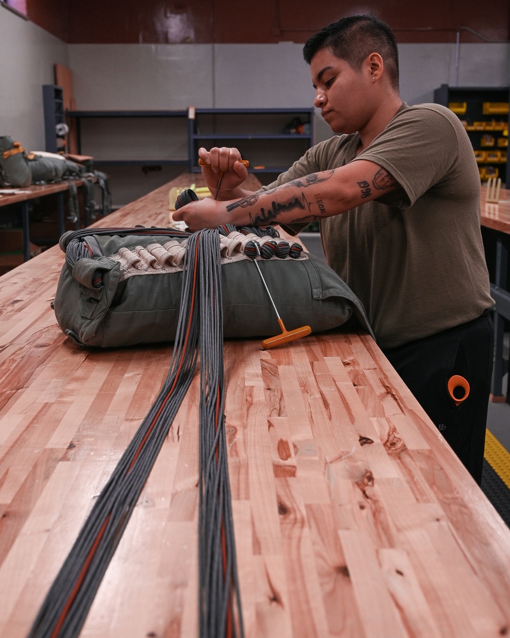 SERE Riggers Pack Parachutes for Training