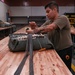 SERE Riggers Pack Parachutes for Training