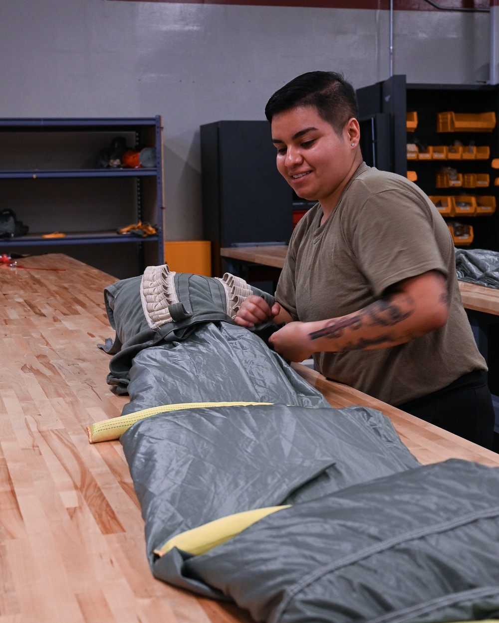 SERE Riggers Pack Parachutes for Training