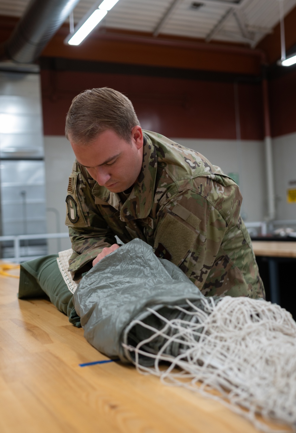 SERE Riggers Pack Parachutes for Training