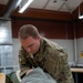 SERE Riggers Pack Parachutes for Training