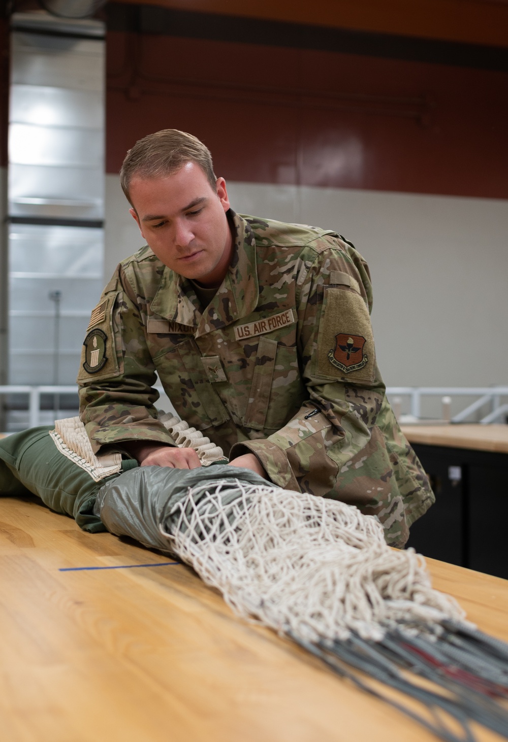 SERE Riggers Pack Parachutes for Training