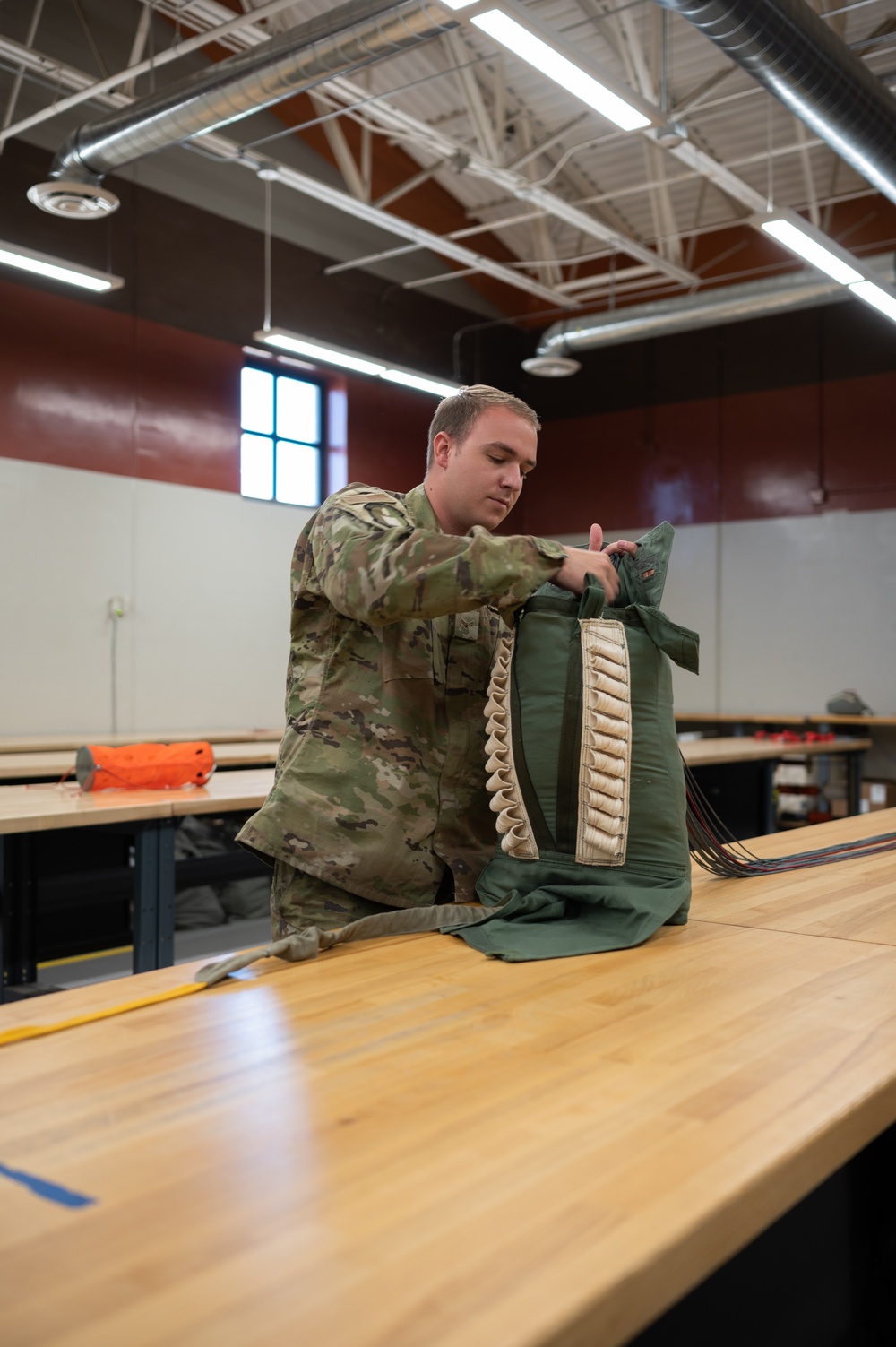 SERE Riggers Pack Parachutes for Training