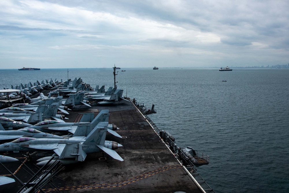 USS Ronald Reagan (CVN 76) departs Manila after a routine port visit