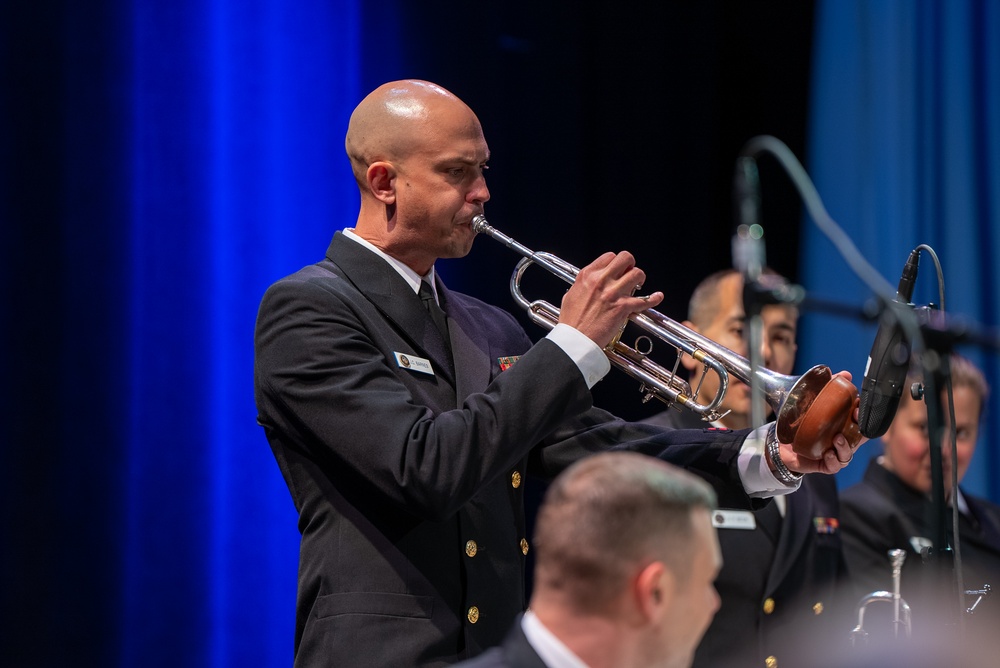 Chief Musician Jonathan Barnes plays a trumpet solo while performing at Howard Middle School Academy of Arts.
