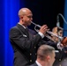 Chief Musician Jonathan Barnes plays a trumpet solo while performing at Howard Middle School Academy of Arts.