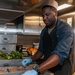 Sailors aboard USS Shoup prepare meals for ship’s crew