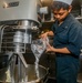 Sailors aboard USS Shoup prepare meals for ship’s crew