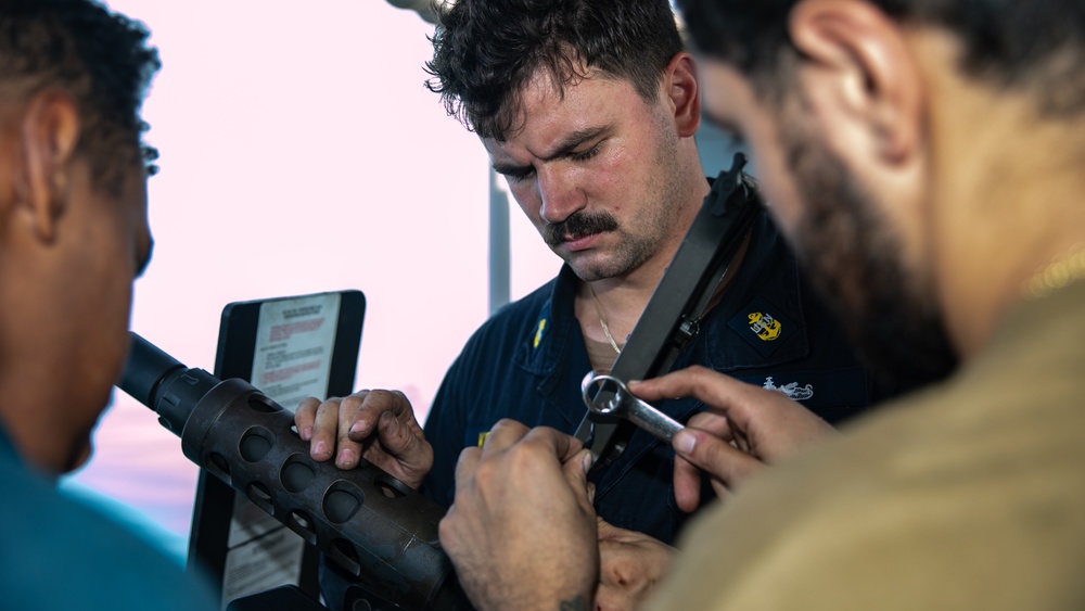 USS Gladiator Conducts Maintenance on a .50-caliber Machine Gun