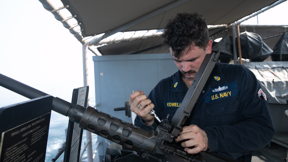 USS Gladiator Conducts Maintenance on a .50-caliber Machine Gun