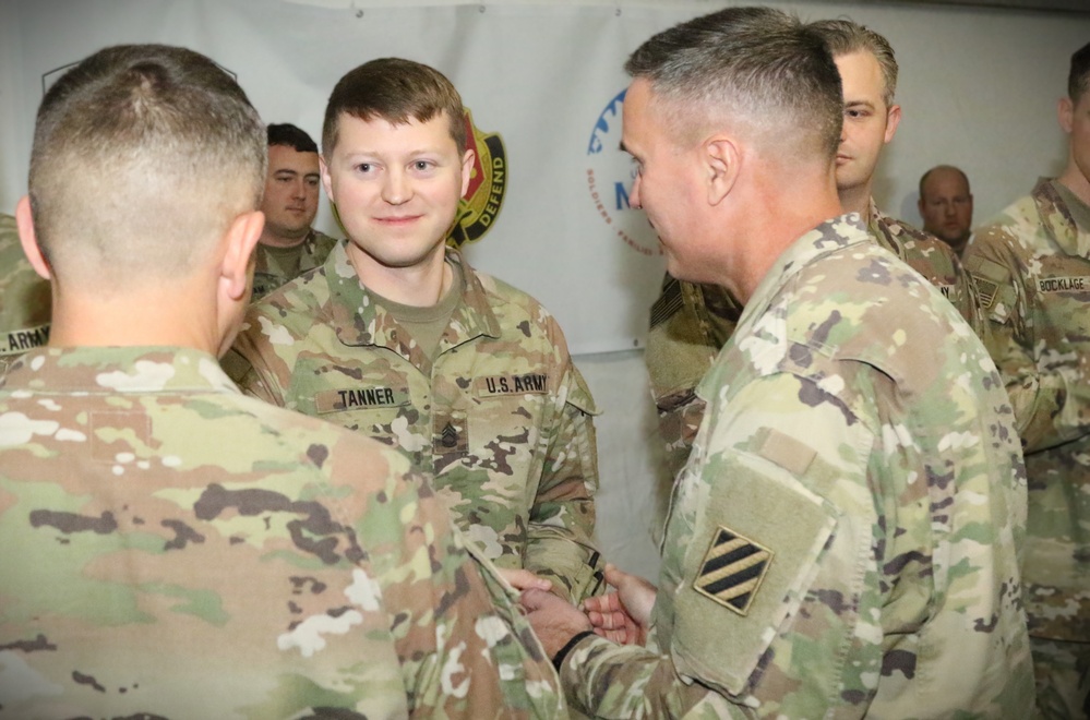 Servicemembers awarded unit coins for CPXIII