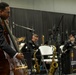Musician 1st Class William Ledbetter talks to patrons at the MetroHealth Stadium