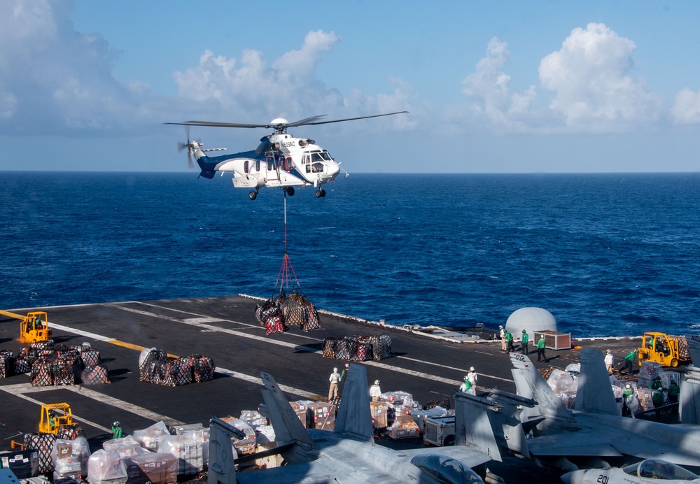 USS Ronald Reagan (CVN 76) conducts vertical replenishment-at-sea with USNS Carl Brashear (T-AKE 7)