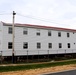 Contractors 'drive' World War II-era barracks buildings at Fort McCoy