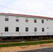 Contractors 'drive' World War II-era barracks buildings at Fort McCoy