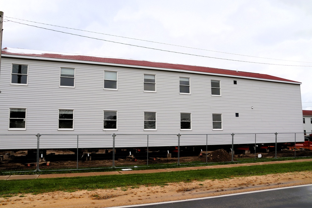 Contractors 'drive' World War II-era barracks buildings at Fort McCoy