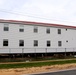 Contractors 'drive' World War II-era barracks buildings at Fort McCoy