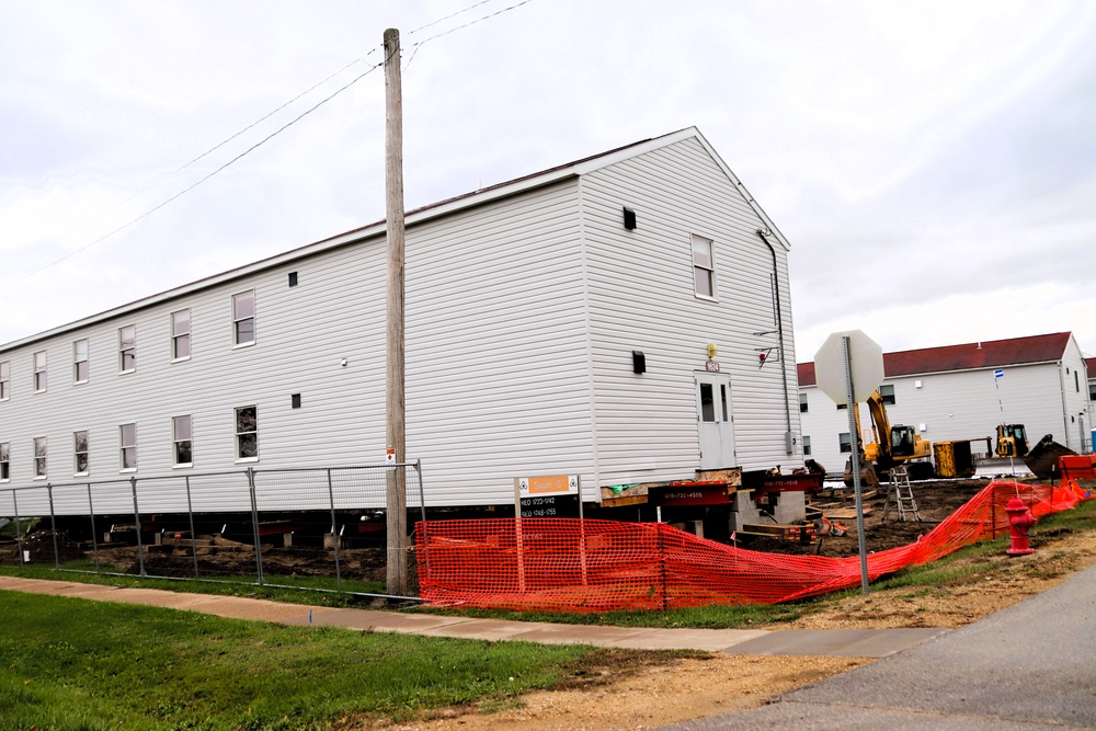 Contractors 'drive' World War II-era barracks buildings at Fort McCoy