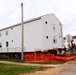 Contractors 'drive' World War II-era barracks buildings at Fort McCoy