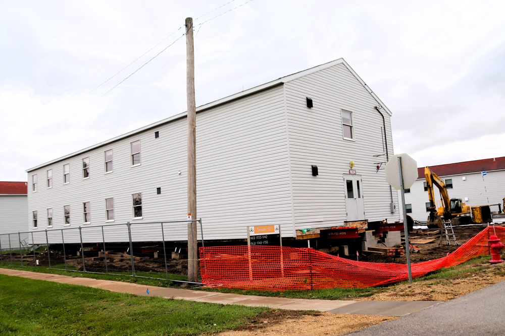 Contractors 'drive' World War II-era barracks buildings at Fort McCoy