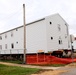 Contractors 'drive' World War II-era barracks buildings at Fort McCoy