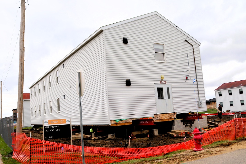 Contractors 'drive' World War II-era barracks buildings at Fort McCoy