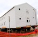 Contractors 'drive' World War II-era barracks buildings at Fort McCoy