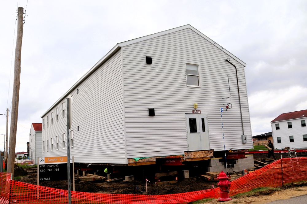 Contractors 'drive' World War II-era barracks buildings at Fort McCoy