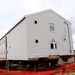 Contractors 'drive' World War II-era barracks buildings at Fort McCoy