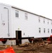 Contractors 'drive' World War II-era barracks buildings at Fort McCoy