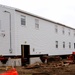 Contractors 'drive' World War II-era barracks buildings at Fort McCoy