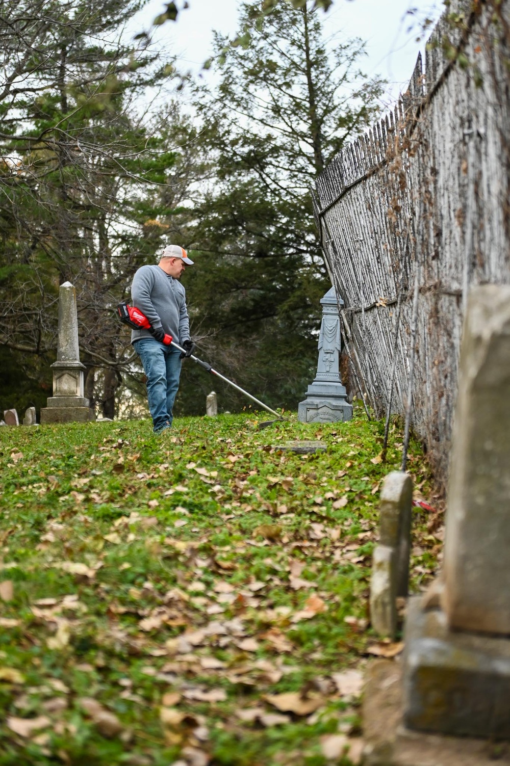 Airmen clean up cemetery where the wing's first commander rests