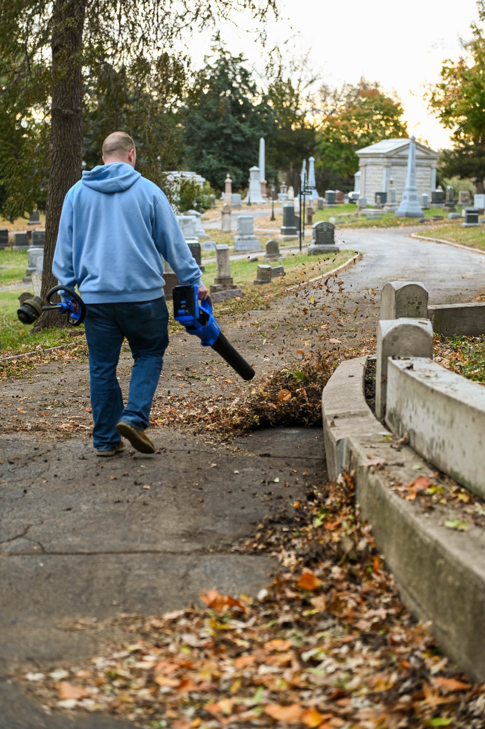 Airmen clean up cemetary where the wing's first commander rests