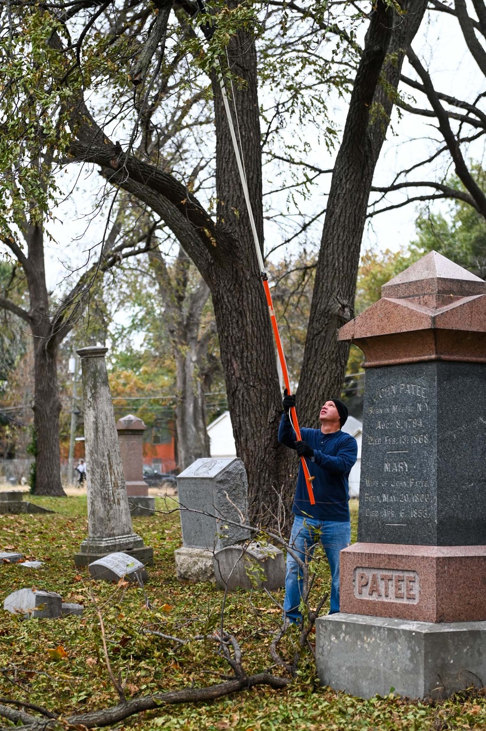 Airmen clean up cemetery where the wing's first commander rests