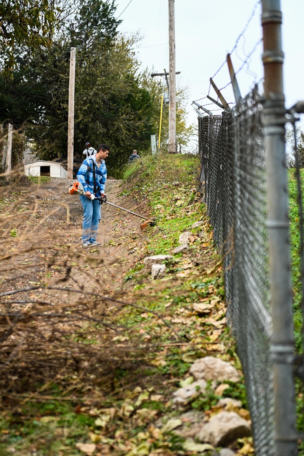 Airmen clean up cemetery where the wing's first commander rests