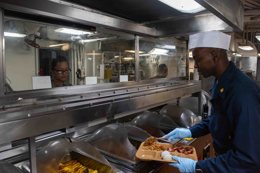 Officer Serves Breakfast to Enlisted Crew Aboard USS Theodore Roosevelt