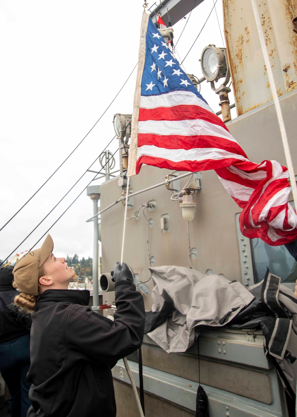 Sailor Raises Ensign