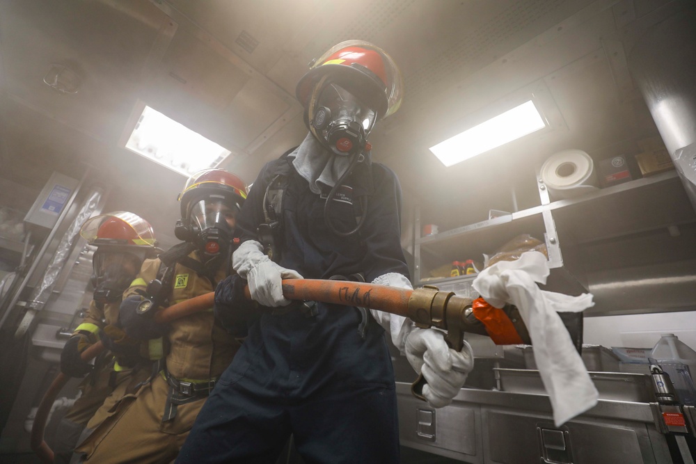 Sailors aboard USS Shoup participate in firefighting drill