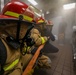 Sailors aboard USS Shoup participate in firefighting drill