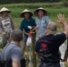 DPAA and Vietnamese locals build a cofferdam