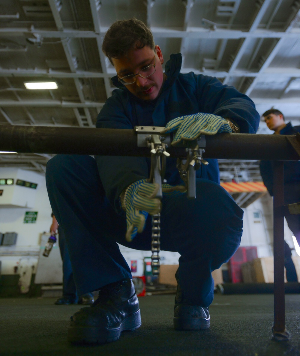 Sailor Practices Pipe Patching