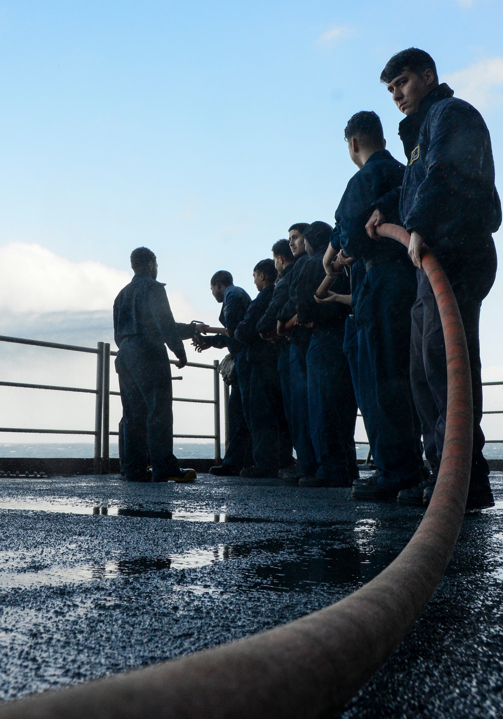 Sailors Man Fire Hose