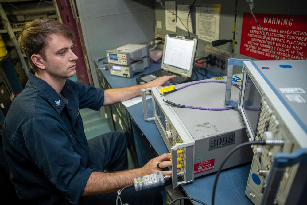 U.S. Navy Sailor Calibrates Equipment