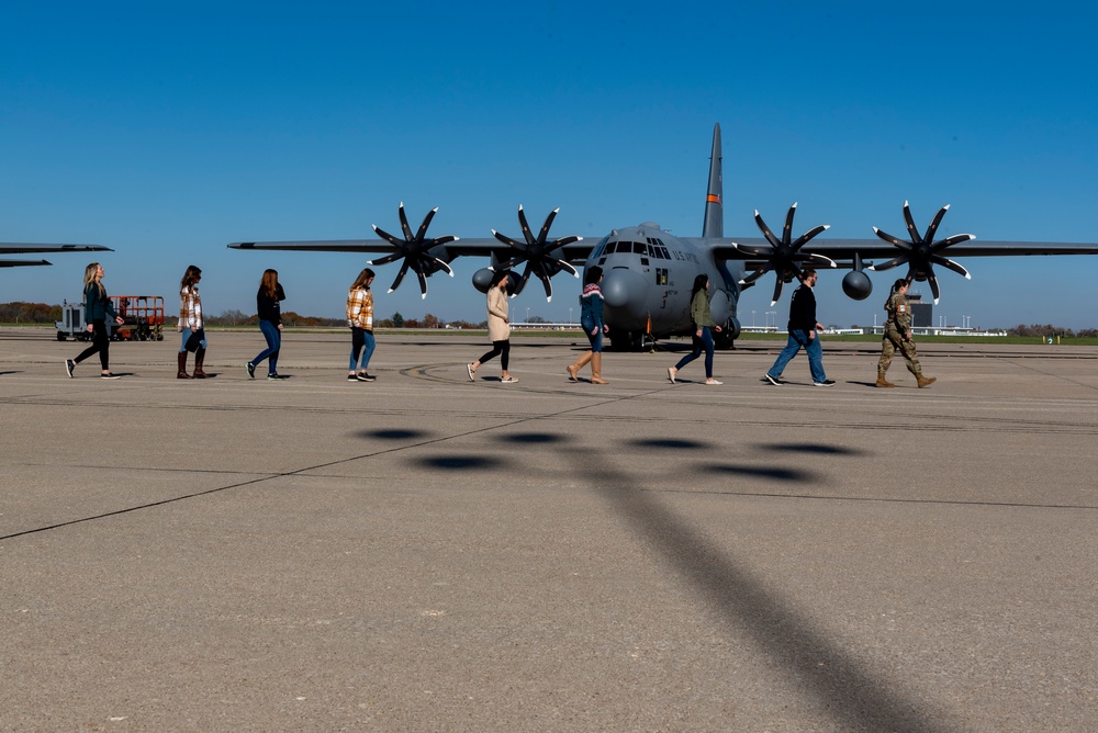 Spouses of members of the 182nd Operations Group fly on a C-130H3